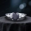 Oval-cut blue sandstone engagement ring with galaxy sparkle, perfect for proposals and weddings