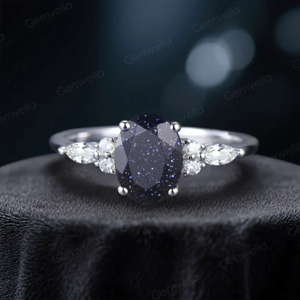 Oval-cut blue sandstone engagement ring with galaxy sparkle, perfect for proposals and weddings