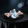 Pear-shaped aquamarine engagement ring with rose gold band and delicate prongs