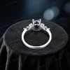 Macro photo of oval blue sandstone engagement ring showing cosmic glitter and sapphire halo