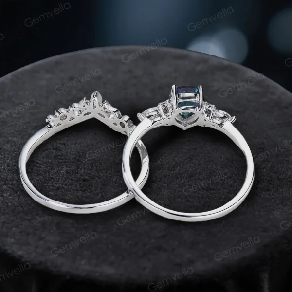 Top-down photo of pear alexandrite and Celtic knot ring set on velvet background