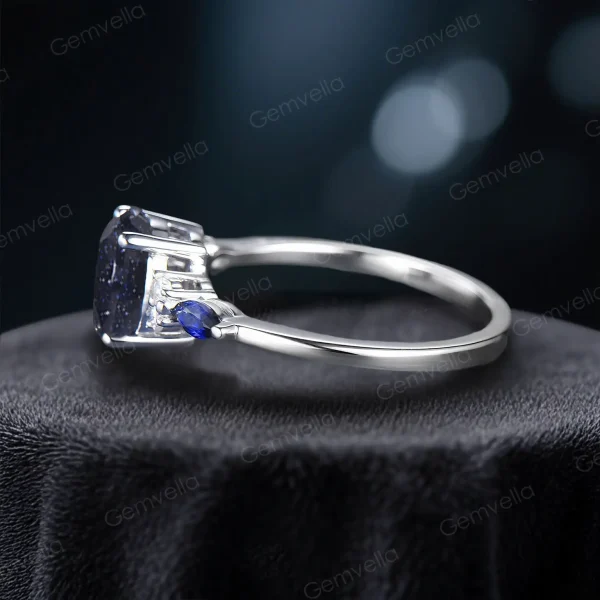 Low-profile wedding band with delicate marquise sapphire side stones, comfortable for daily wear