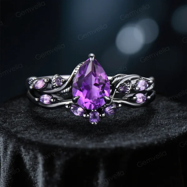Nature-inspired engagement ring with pear-cut amethyst, in black gold vine band.