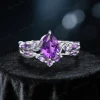 Front view of 1.25ct pear amethyst and 925 sterling silver nature-inspired bridal ring set.