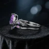 Low-profile nature-inspired ring set side angle showing intricate branch detailing and stone settings