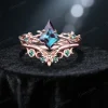 1ct kite cut color change alexandrite engagement ring set featuring celtic knot and twisted twig vine design in 14k rose gold front view.