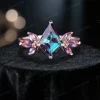 Front view of 14K rose gold art deco engagement ring featuring a central kite alexandrite and marquise amethyst cluster setting.