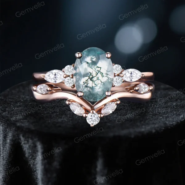 Front view of 1.5ct oval natural green moss agate and marquise moissanite cluster engagement ring set in 10k rose gold