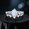 Front view of 1.25ct pear cut opal engagement ring set with sterling silver nature inspired twig vine and leaf design, showcasing the pear shaped opal center stone and delicate metalwork details