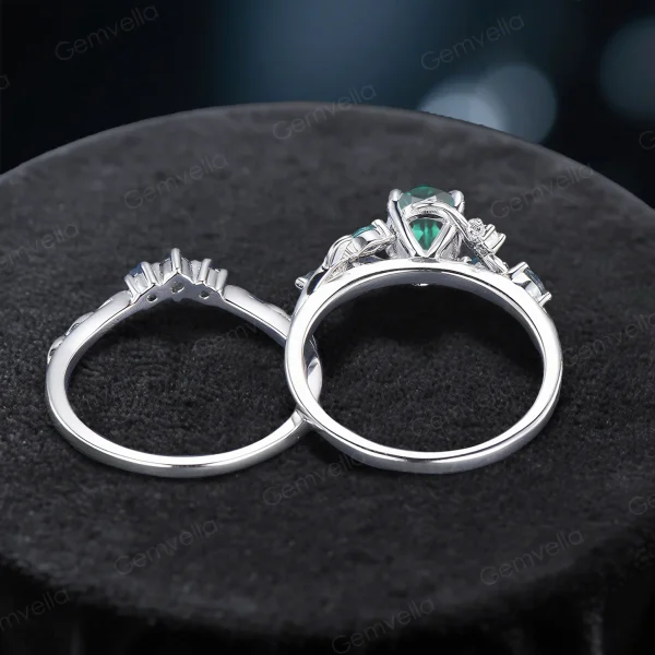 Top down view of 10K rose gold ring set band showing the width, thickness, and leaf vine branch engraving detail for 1.5ct oval emerald bridal set