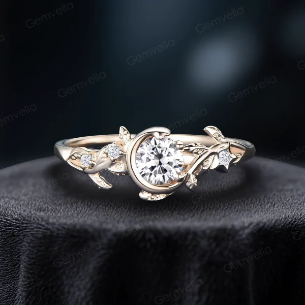 Side profile of a classic yellow gold engagement ring showcasing a brilliant 1ct round moissanite stone, detailed with a vintage celestial moon star design and delicate leaf textures.