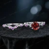 Flat lay photography of the two-piece ring set separated to show the detailed craftsmanship of the matching bands, highlighting the organic leaf patterns on both the engagement ring and the accompanying wedding band set with Amethysts.