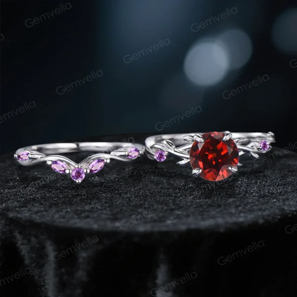 Flat lay photography of the two-piece ring set separated to show the detailed craftsmanship of the matching bands, highlighting the organic leaf patterns on both the engagement ring and the accompanying wedding band set with Amethysts.