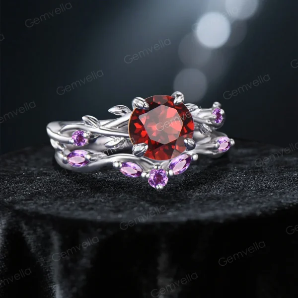 45-degree angle shot revealing the three-dimensional depth of the leaf and vine motif, the deep red brilliance of the central Natural Garnet, and the rich violet hue of the surrounding Amethyst accents creating a stunning color contrast.