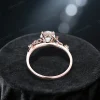 Top down view of a vintage rose gold moissanite engagement ring showing the leaf vine nature inspired band width and thickness, designed for a comfortable fit with diamond alternative gemstone setting