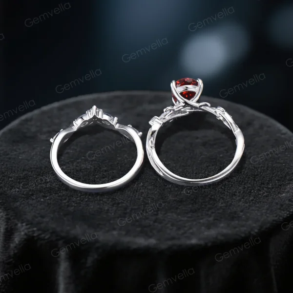 Overhead close-up looking directly down at the ring set, emphasizing the sturdy thickness of the silver band and the smooth interior finish designed for comfortable daily wear, with the Garnet and Amethyst arrangement visible.