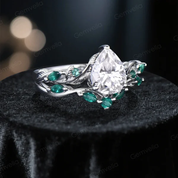 Angled perspective of the vintage twig vine moissanite engagement ring set, capturing the dimensional leaf and branch details alongside the sparkle of pear and emerald cut moissanite stones.