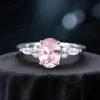 1.5ct oval pink sapphire and marquise moissanite engagement ring front view showcasing center stone and band details