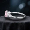 Side profile of handmade pink sapphire and moissanite ring showing band thickness and stone setting height