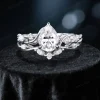 Close-up of the sterling silver metalwork on the nature inspired moissanite engagement ring set, showing the polished finish of the leaf vine and branch twist band