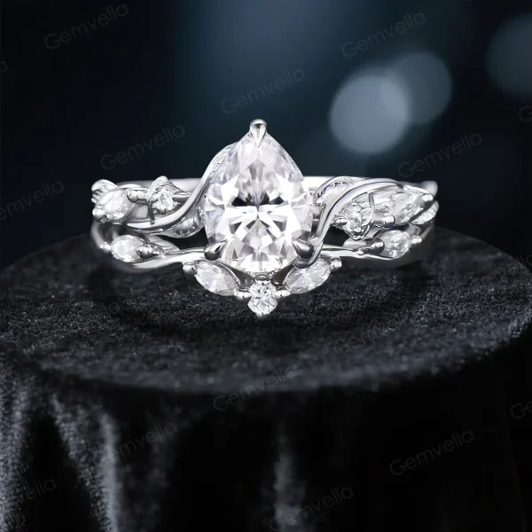 Close-up of the sterling silver metalwork on the nature inspired moissanite engagement ring set, showing the polished finish of the leaf vine and branch twist band