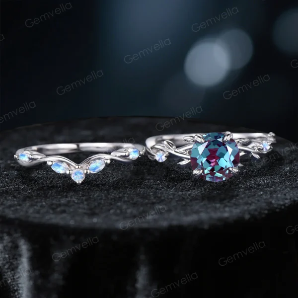 Flat lay photography of the two-piece ring set separated to show the detailed craftsmanship of the matching bands, highlighting the organic leaf patterns on both the engagement ring and the accompanying wedding band.