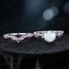 Flat lay photography of the two-piece ring set separated to show the detailed craftsmanship of the matching bands, highlighting the organic leaf patterns on both the engagement ring and the accompanying wedding band set with Amethysts.