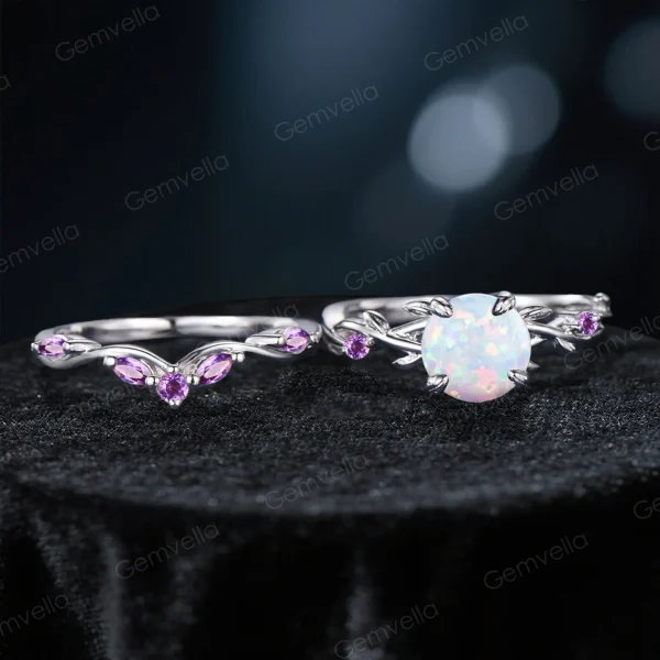 Flat lay photography of the two-piece ring set separated to show the detailed craftsmanship of the matching bands, highlighting the organic leaf patterns on both the engagement ring and the accompanying wedding band set with Amethysts.
