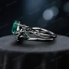 Side profile view of the black gold emerald and moss agate ring set, highlighting the twig vine detailing along the band and the thickness of the wedding band.