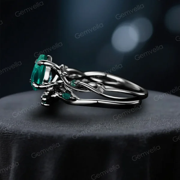 Side profile view of the black gold emerald and moss agate ring set, highlighting the twig vine detailing along the band and the thickness of the wedding band.
