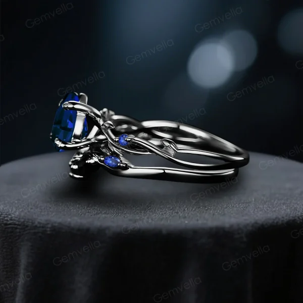 Side profile view of the black gold blue sapphire ring set, highlighting the twig vine detailing along the band and the thickness of the wedding band.