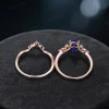 Top down view highlighting the oval cut Blue Sapphire center stone surrounded by marquise cut moissanite accents.