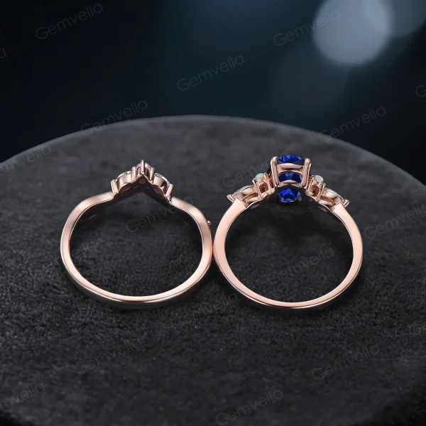Top down view highlighting the oval cut Blue Sapphire center stone surrounded by marquise cut moissanite accents.