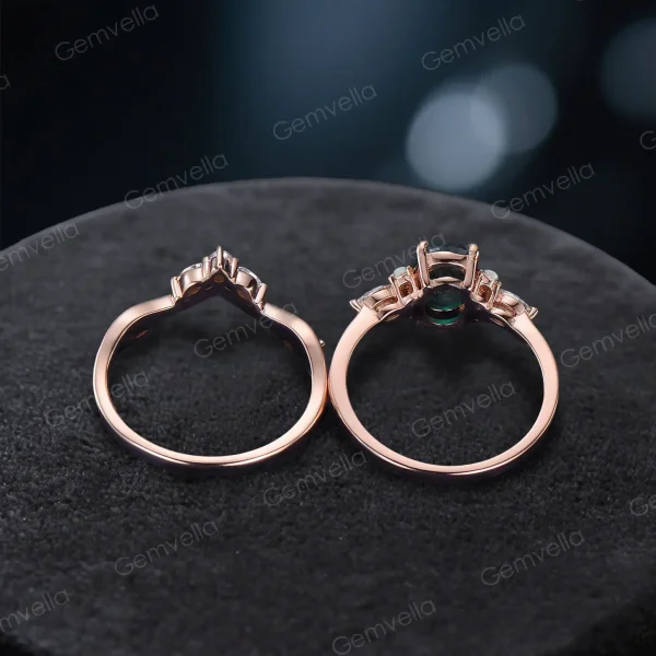 Top down view highlighting the oval cut green moss agate center stone surrounded by marquise cut moissanite accents.