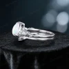 Side profile of 1.25ct pear cut opal engagement ring set showing the sterling silver twig vine band thickness, opal stone setting height, and nature inspired leaf accents on the side of the ring