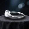 Side profile of the handmade moissanite ring, highlighting the band curvature, setting height of the oval stone, and detailed metalwork of the vintage style.