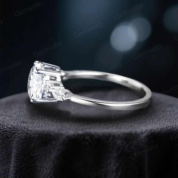 Side profile of the handmade moissanite ring, highlighting the band curvature, setting height of the oval stone, and detailed metalwork of the vintage style.