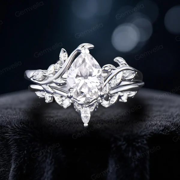 Budget-friendly sterling silver version of the 1.25ct pear moissanite bypass ring with leaf vine branch detailing, offering the same nature-inspired design and brilliant center stone at an accessible price point for brides seeking elegant silver bridal jewelry.