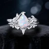 Front view of the 1.25ct pear cut white opal bridal set made in sterling silver, offering an affordable nature inspired leaf vine bypass ring set option for women.