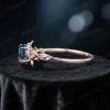 Side profile of the 1ct London Blue Topaz and Moonstone ring, displaying the rose gold band thickness, prong setting height, and vintage-inspired metalwork.
