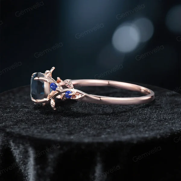 Side profile of the 1ct London Blue Topaz and Blue Sapphire ring, displaying the rose gold band thickness, prong setting height, and vintage-inspired metalwork details.