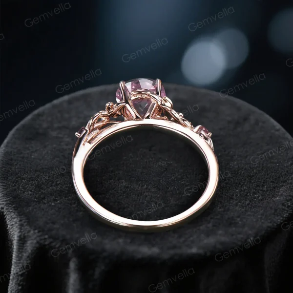 Top down view of a nature inspired pink sapphire and pink tourmaline ring showing the band width thickness and leaf vine branch pattern around the shank