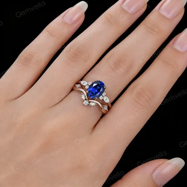 Woman's hand wearing the Blue Sapphire and moissanite bridal set, showing the ring size and sparkle on finger.