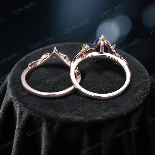 Top down view highlighting the band width and thickness of the unique handmade sapphire ring, showcasing the sturdy leaf design shank.