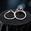 Side profile view of the blue sapphire bridal set highlighting the organic leaf and branch metalwork and ring band thickness