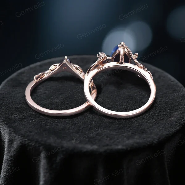 Side profile view of the blue sapphire bridal set highlighting the organic leaf and branch metalwork and ring band thickness