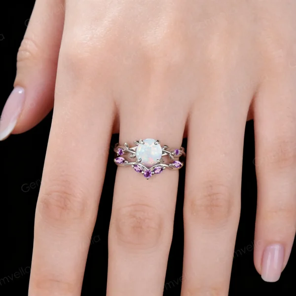 Lifestyle close-up of the vintage Opal and Amethyst ring set worn on a woman's finger, demonstrating how the twisting vine design wraps elegantly around the hand and complements the skin tone with its purple and iridescent accents.
