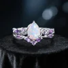 Nature-inspired engagement ring set with 1.25ct pear-cut opal in silver finish, twig and vine botanical design