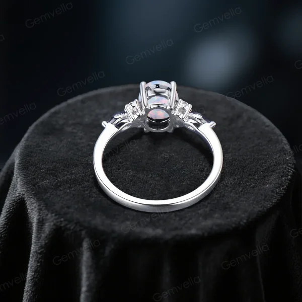 Top-down view of the 1.5ct Oval Opal and Marquise Moissanite ring displaying the symmetrical arrangement of the central opal and marquise accents, ideal for unique bridal jewelry.